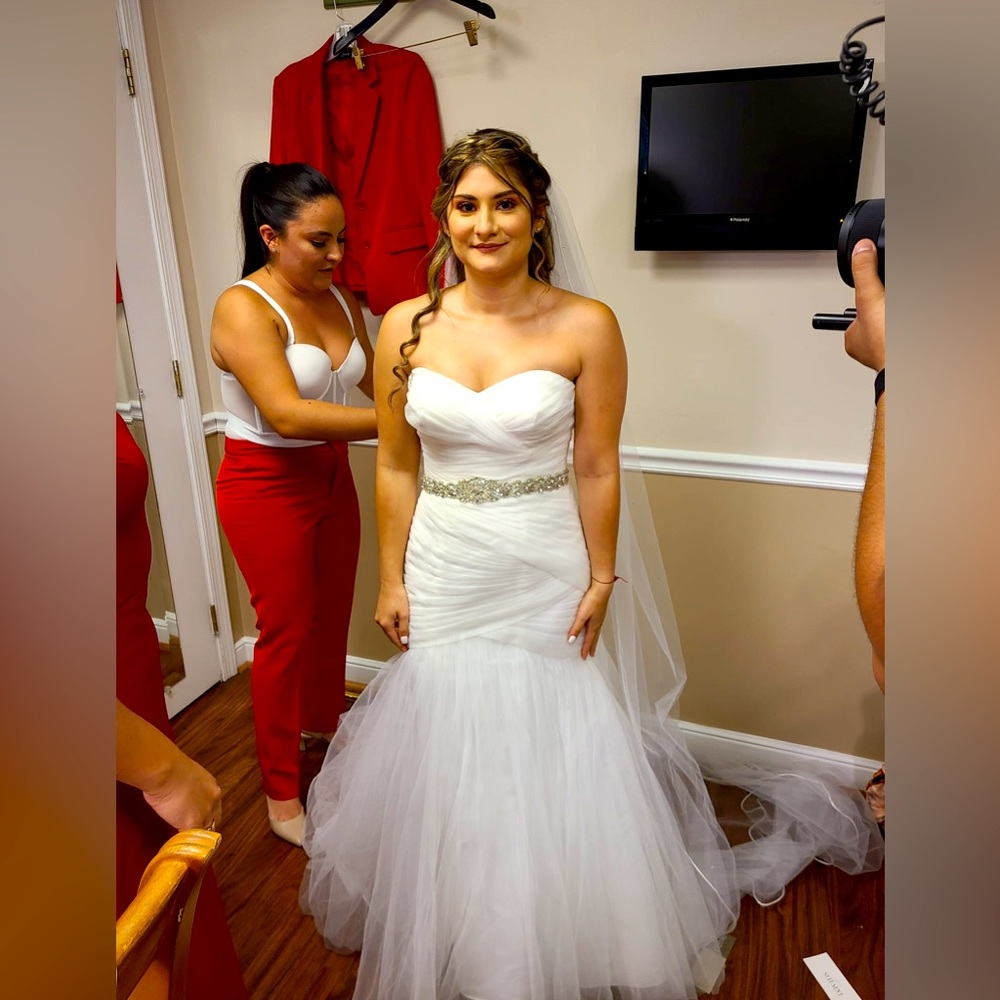 Simple long mermaid style wedding dress with sparkling waistband attachment.